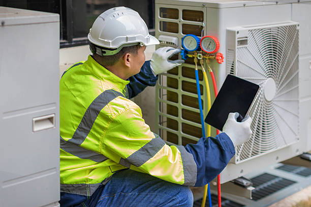 Professional Heat Pump Repair technician working in Clayton, NC